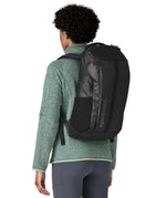 Person wearing the Patagonia Black Hole® Backpack 25 litre in black on their back. 