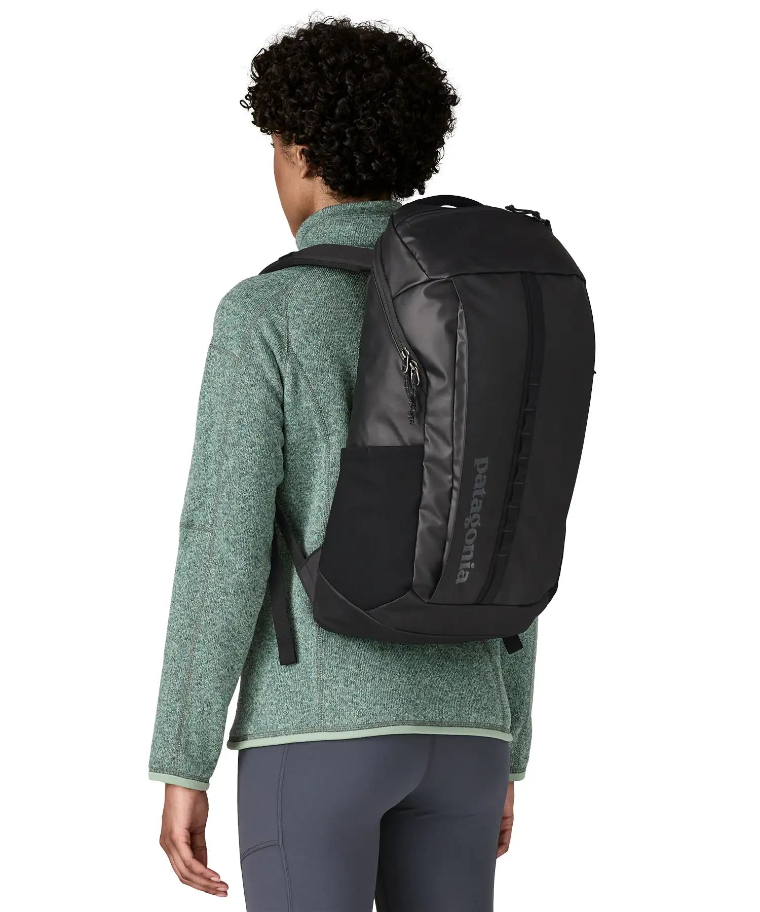 Person wearing the Patagonia Black Hole® Backpack 25 litre in black on their back. 