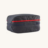 Patagonia Black Hole Cube 6L travel organiser bag in Smolder Blue with red accents, durable recycled polyester packing cube.