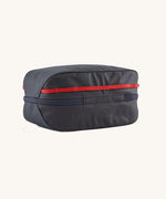 Patagonia Black Hole Cube 6L travel organiser bag in Smolder Blue with red accents, durable recycled polyester packing cube.