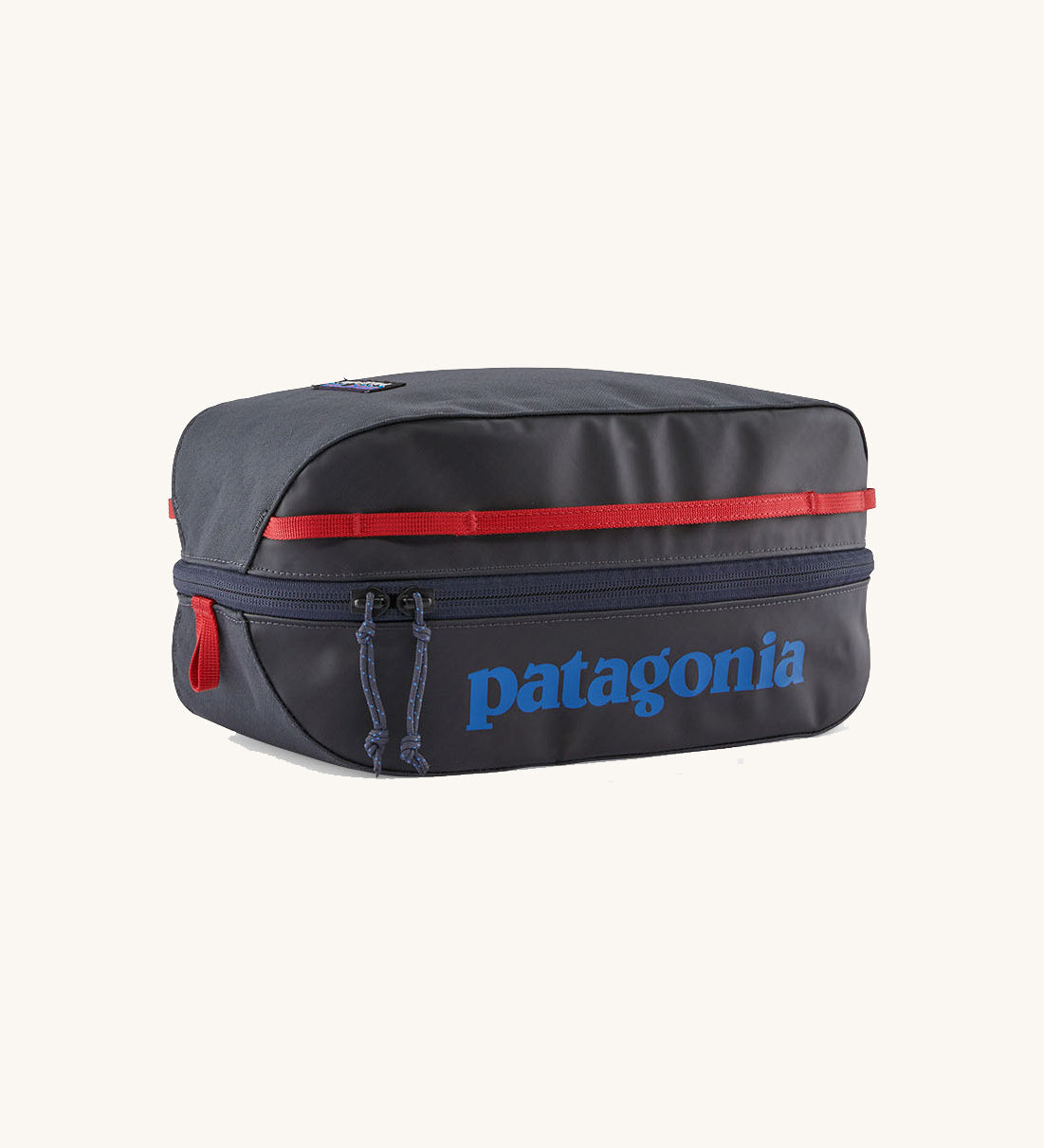 Patagonia Black Hole Cube 6L travel packing cube in Smolder Blue with Amanita Red details, lightweight recycled organiser bag.