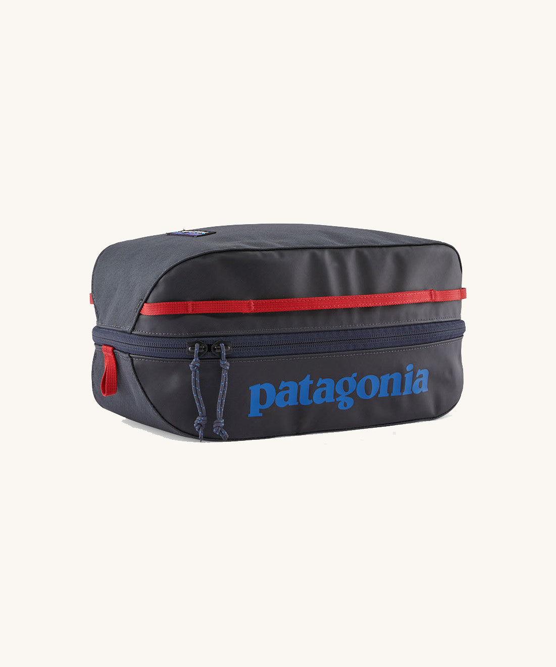 Patagonia Black Hole Cube 6L travel packing cube in Smolder Blue with Amanita Red details, lightweight recycled organiser bag.