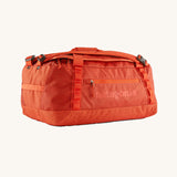 The Patagonia Black Hole Duffel 40L in Pollinator Orange on a plain background.