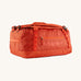The Patagonia Black Hole Duffel 40L in Pollinator Orange on a plain background.