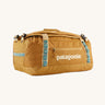 The Patagonia Black Hole Duffel 40L in Pufferfish Gold on a plain background. 
