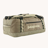 Patagonia black hole duffel 55 litre bag in weathered stone with padded straps.