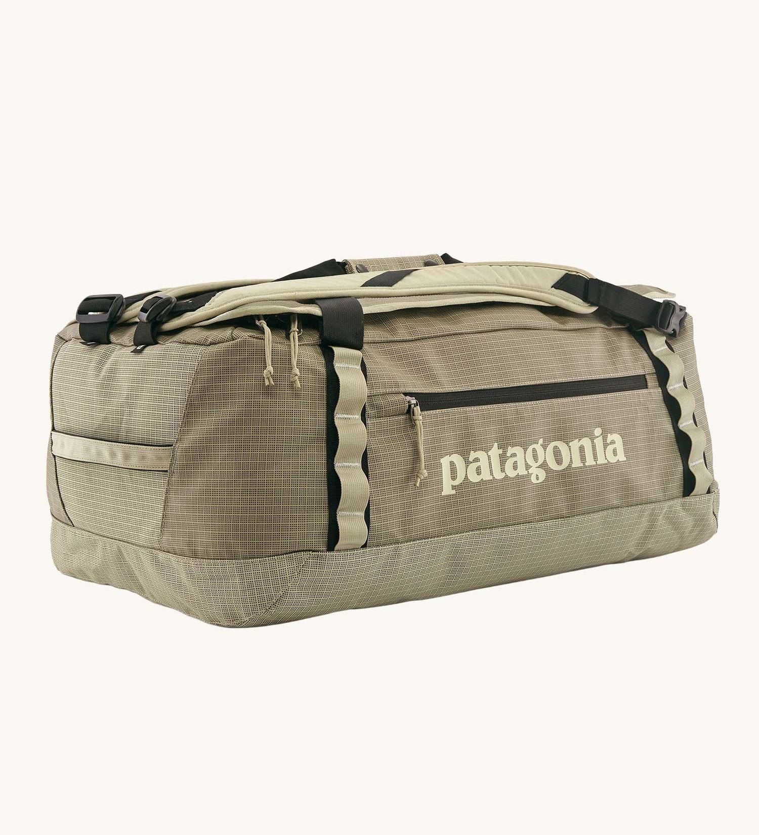 Patagonia black hole duffel 55 litre bag in weathered stone with padded straps.