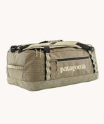 Patagonia black hole duffel 55 litre bag in weathered stone with padded straps.