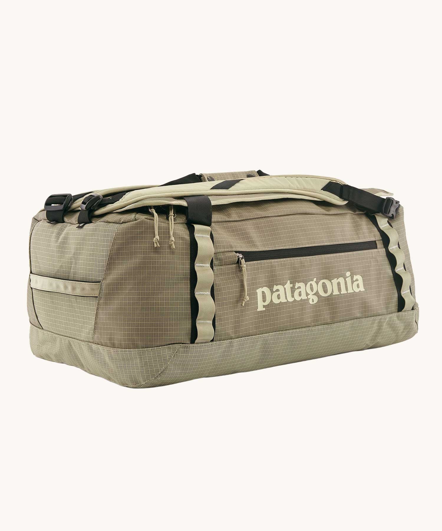 Patagonia black hole duffel 55 litre bag in weathered stone with padded straps.