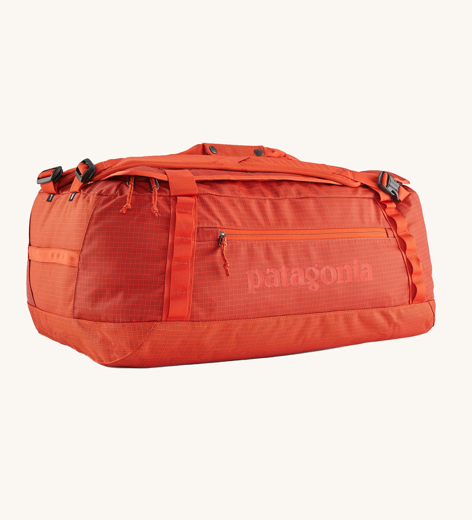 A Patagonia Black Hole Duffel 55L in Pollinator Orange on a plain background.