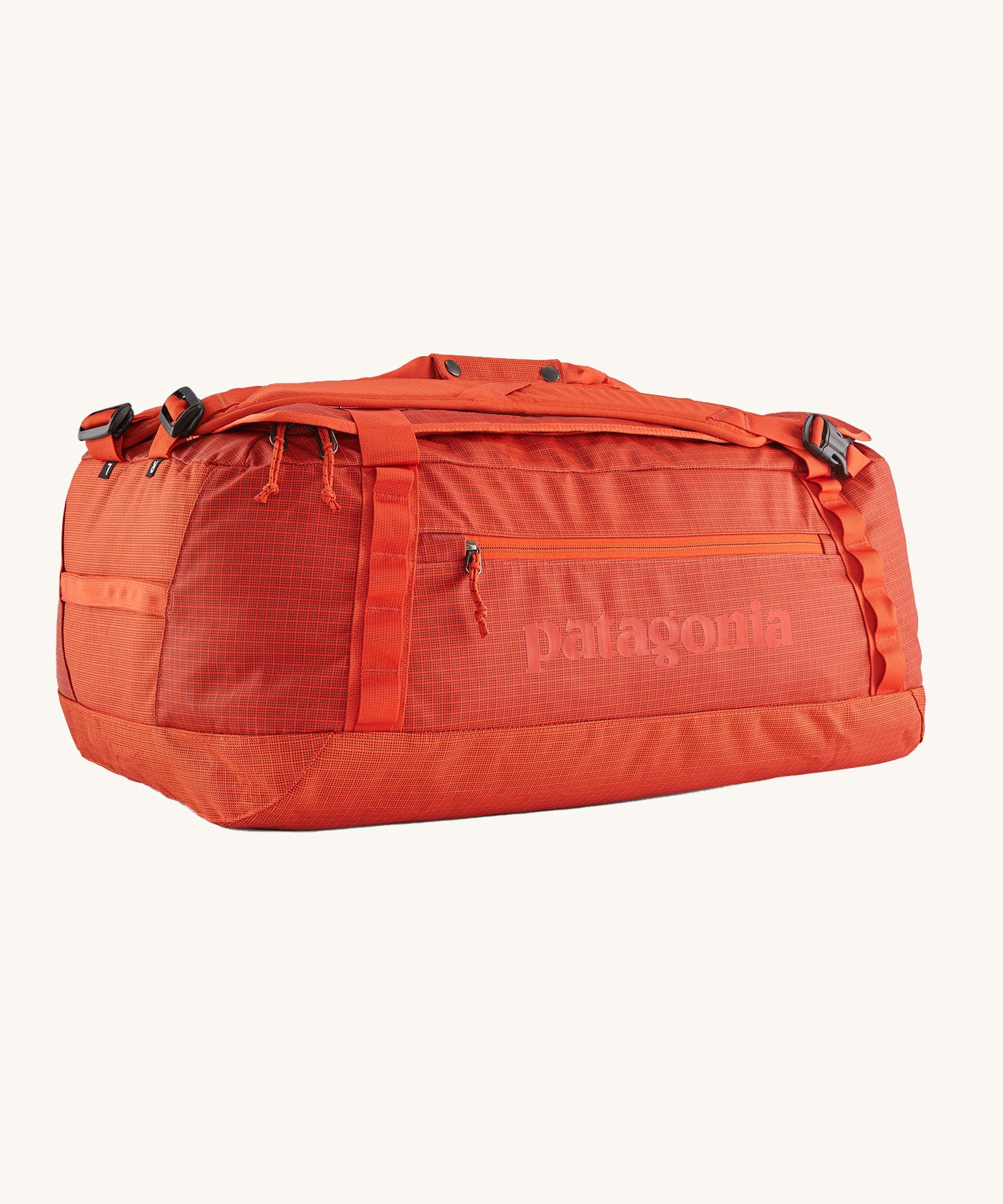 A Patagonia Black Hole Duffel 55L in Pollinator Orange on a plain background.