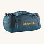 The Patagonia Black Hole Duffel Bag 55L in a Tidal Teal colour on a plain background. 