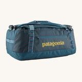 The Patagonia Black Hole Duffel Bag 55L in a Tidal Teal colour on a plain background. 