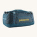 The Patagonia Black Hole Duffel Bag 55L in a Tidal Teal colour on a plain background. 