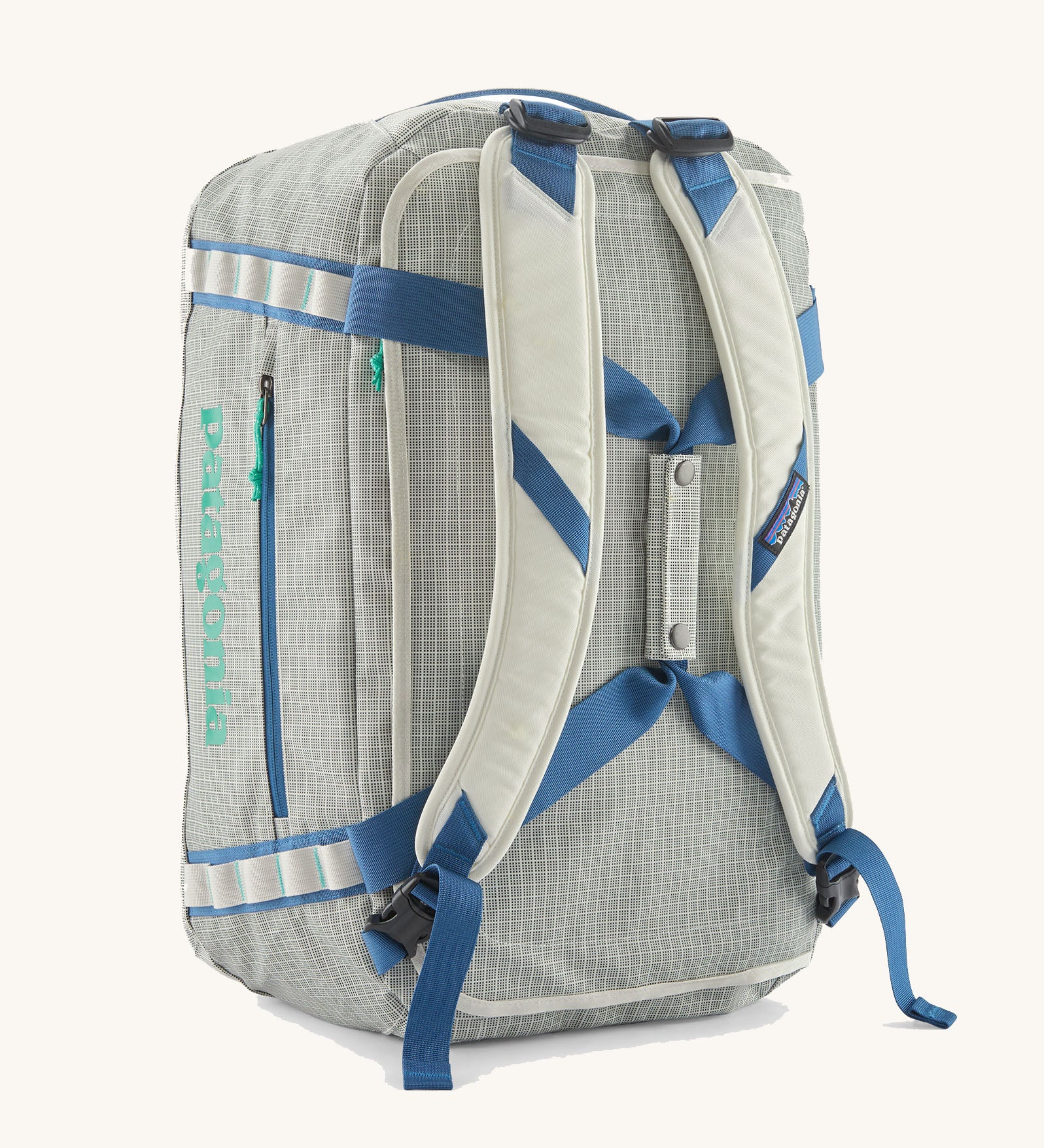 Patagonia black hole 40L duffel bag  in birch white with padded back straps.