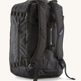 The back of The Patagonia Black Hole 40 Litre Luggage Backpack in monochrome black, showing the shoulder straps.