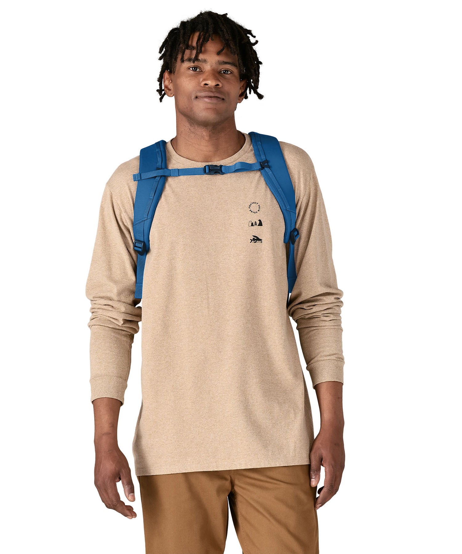 An adult wearing the The Patagonia Black Hole Backpack 25 litre capacity backpack, in endless blue.