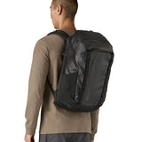 Person wearing the Patagonia Black Hole Pack 32L black travel backpack, demonstrating fit and size.