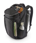 Patagonia Black Hole Pack 32L black shown open and filled with travel essentials, displaying internal organisation and side pockets.
