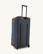 Patagonia black hole wheeled large capacity 100L duffel bag in black with a retractable handle.