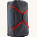 Patagonia black hole wheeled large capacity 100L duffel bag in black with red strap and blue logo on front.