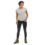 Woman stood on a white background wearing the Patagonia eco-friendly pack out hiking leggings in the black colour