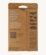 Patagonia worn wear patches in black back packaging detail on a cream background.