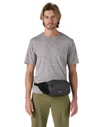 Patagonia terravia hip bag in a black colour worn by an adult