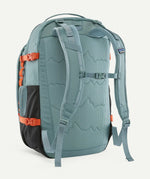 Back of the Patagonia blue sage refugio day pack 32L backpack with padded straps and quick release buckle chest strap.