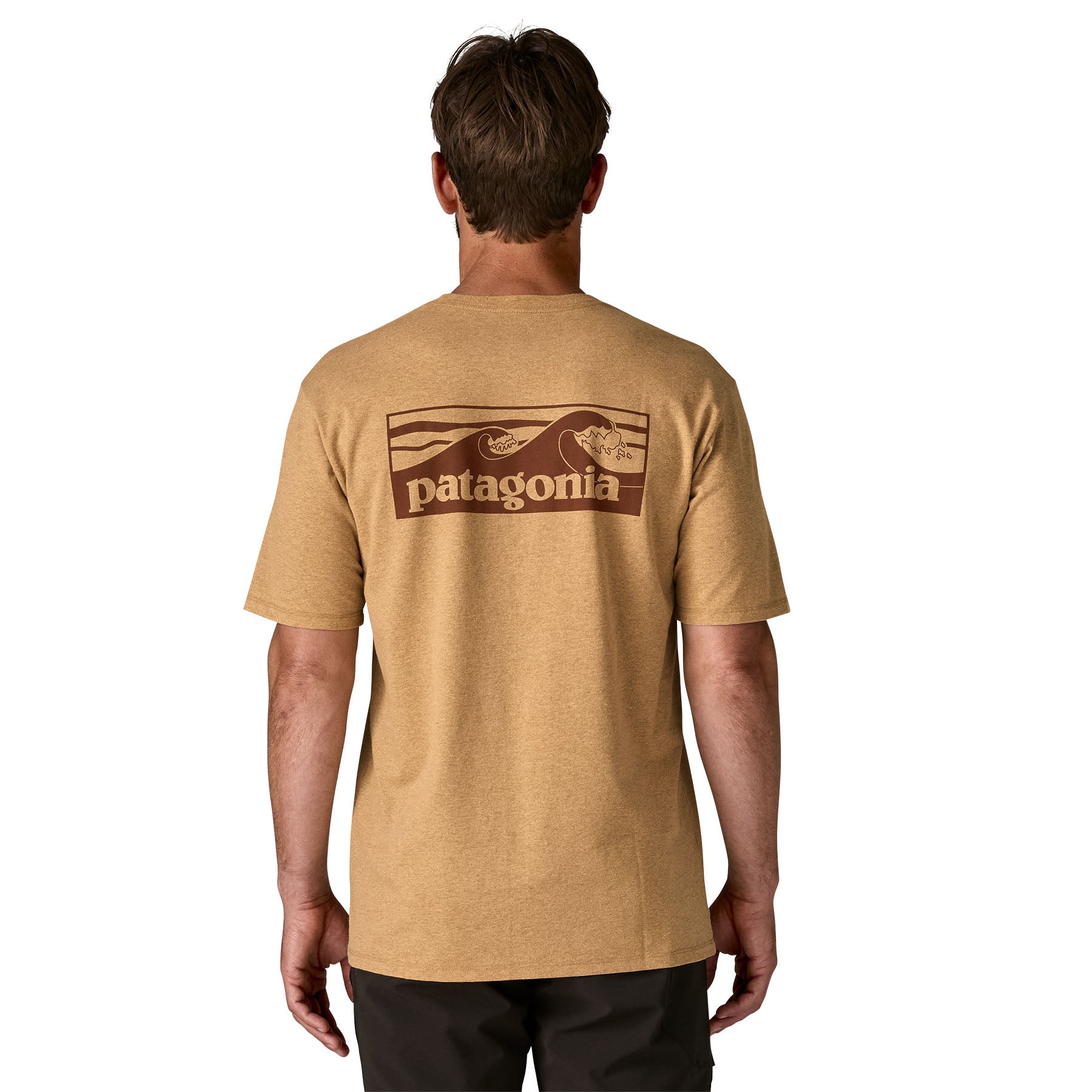 A man wearing a Patagonia Men's Boardshort Logo Pocket Responsibili-Tee in talon gold showing the back graphic detail available at Babipur
