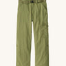 Patagonia kids everyday outdoor pants in a green colour on a cream background.