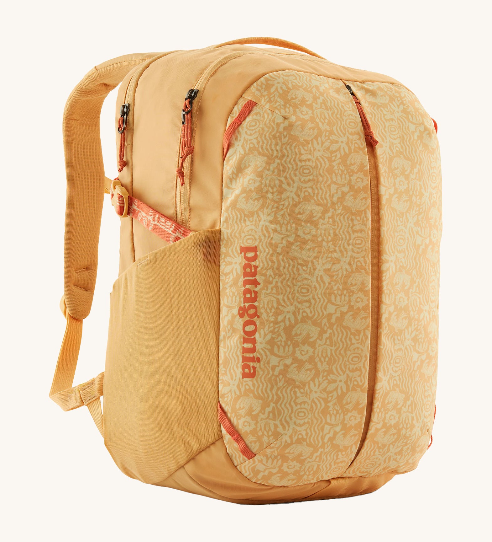 Patagonia yellow 26L day refugio backpack with a buttercup design on a cream background.
