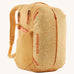 Patagonia yellow 26L day refugio backpack with a buttercup design on a cream background.