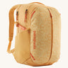 Patagonia yellow 26L day refugio backpack with a buttercup design on a cream background.