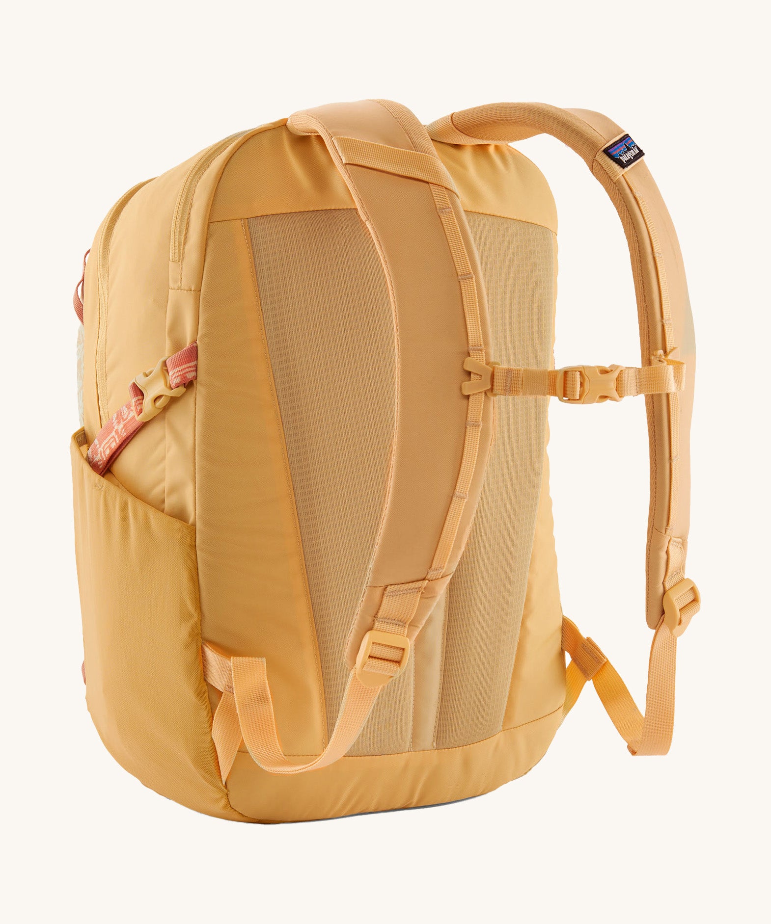 Patagonia yellow 26L day refugio backpack with a buttercup design back detail