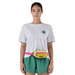A woman modelling the Patagonia mini Terravia bum bag, with the strap fastened around her middle and the hip pack resting at her waist.