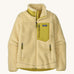 Patagonia women's classic retro fleece jacket in a light yellow colour on a cream background.