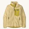 Patagonia women's classic retro fleece jacket in a light yellow colour on a cream background.