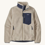 Patagonia women's retro-x fleece in a natural cream colour with a navy check pocket and collar on a cream background.