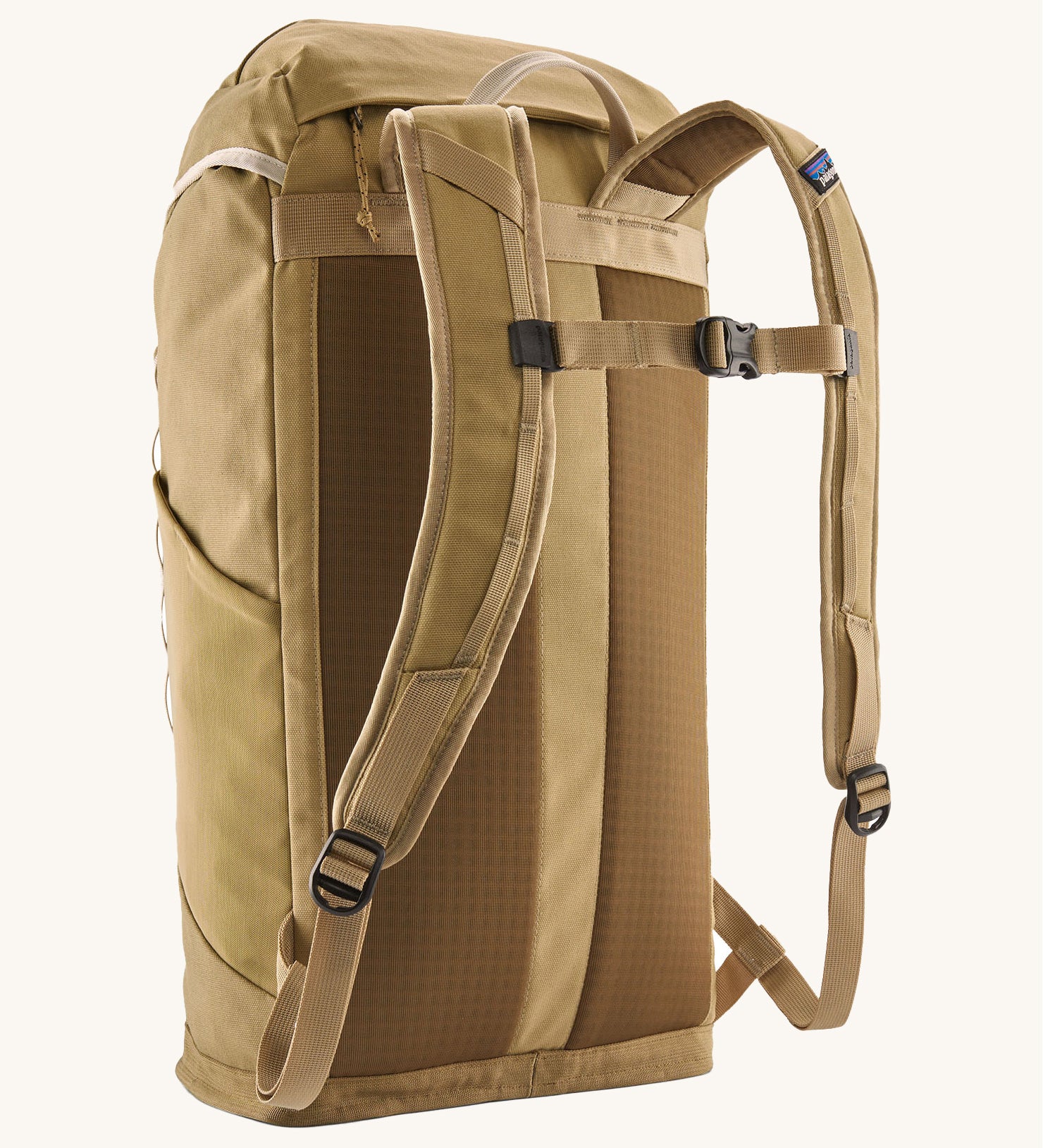 Back view of the Patagonia lid fieldsmith lid backpack in classic tan. Showing the shoulder strap detail and buckle fastening for extra carrying security.