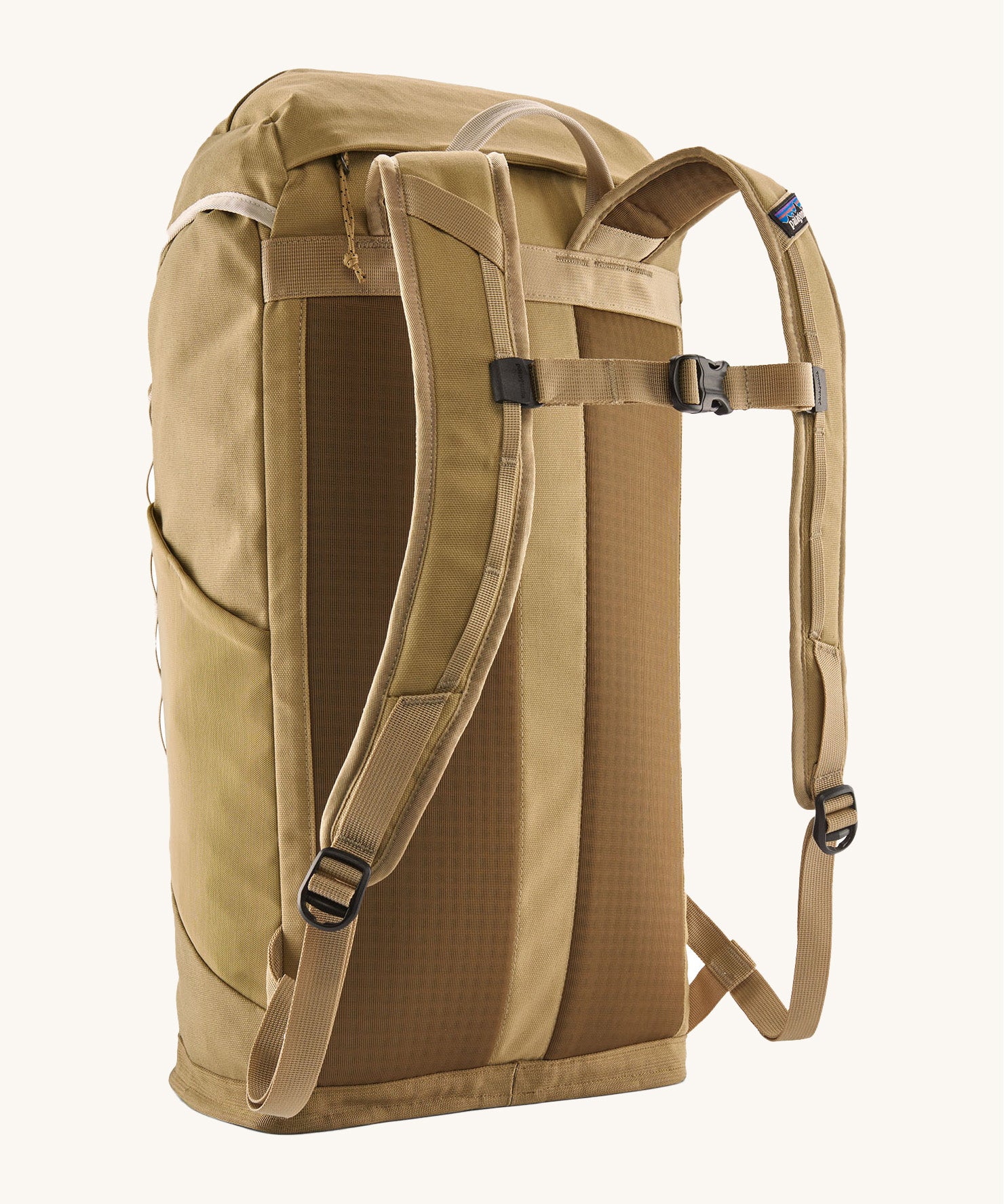 Back view of the Patagonia lid fieldsmith lid backpack in classic tan. Showing the shoulder strap detail and buckle fastening for extra carrying security.