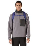 Patagonia purple 26L day refugio backpack worn by an adult shoulder straps and clip detail