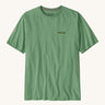 Patagonia mens Fitz roy responsibili top. A green cotton long sleeve t-shirt showing the brand name printed on the left chest and a small badge icon on the right sleeve.