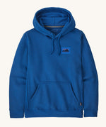 Patagonia men's hoodie in endless blue colour on a cream background.