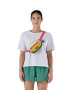 A woman wearing the Terravia mini bum bag from Patagonia, strapped over one shoulder so that is crosses over her chest. 