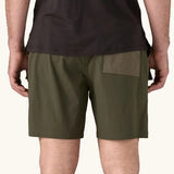 Back of the Patagonia Men's Outdoor Everyday Shorts in Pine Needle Green being worn.