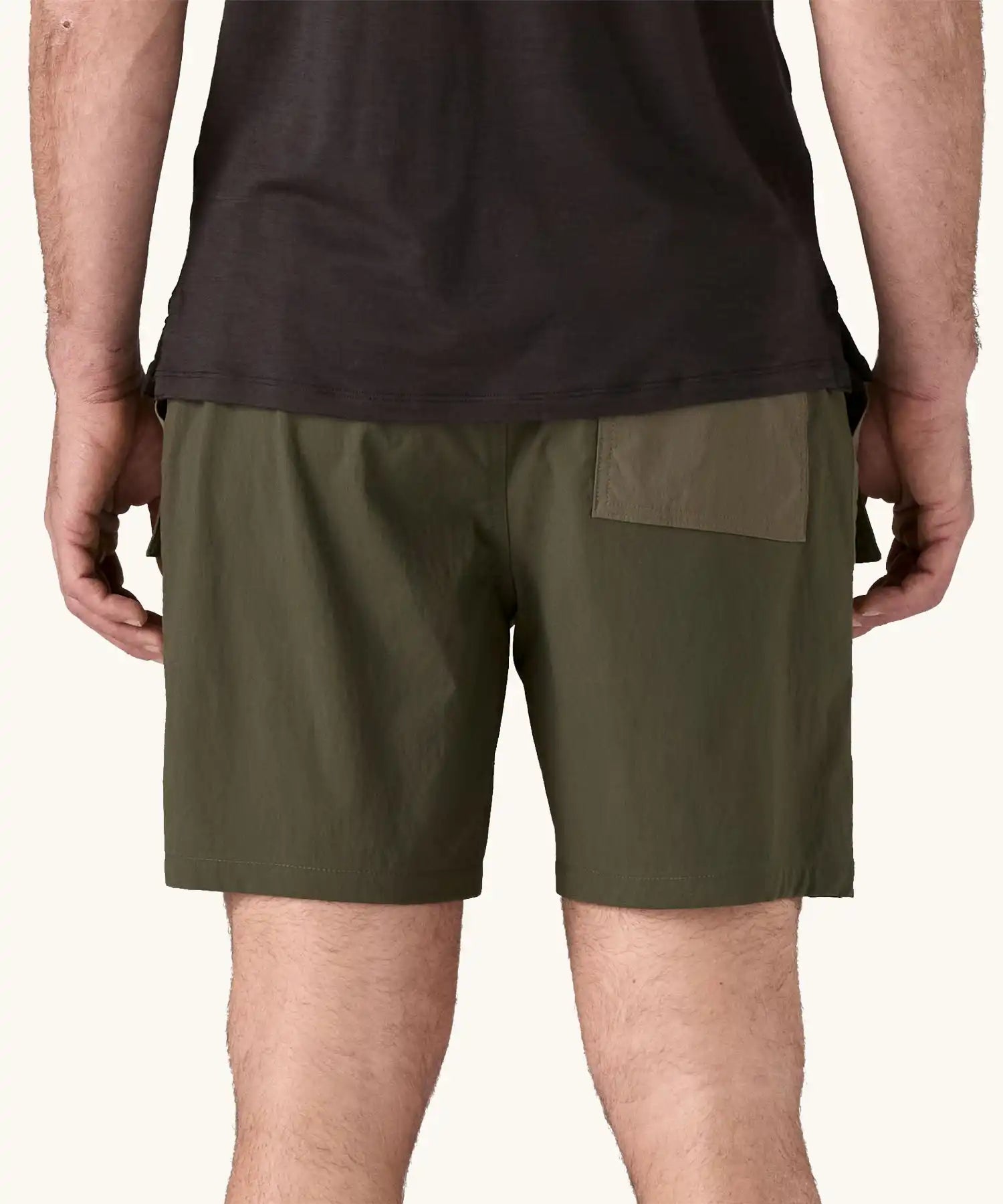 Back of the Patagonia Men's Outdoor Everyday Shorts in Pine Needle Green being worn.