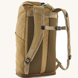 Patagonia fieldsmith roll top backpack in classic tan with padded straps, chest strap with quick release buckle.