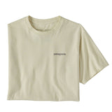 The Patagonia Adult Fitz Roy Icon Responsibili-Tee in a Birch White colour folded into a square with one sleeve out. The grey coloured patagonia logo can be seen on the top left of the top.