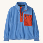 Patagonia kids half zip fleece in light blue colour on a cream background.